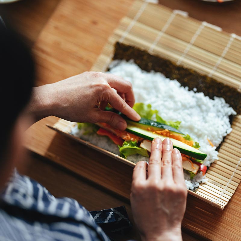 Chef preparing sushi on a bamboo mat. ©istockphoto by miniseries
