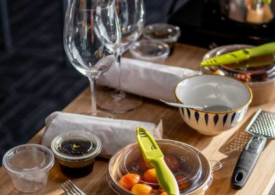 A cutting board showing ingredients and tools for a cooking class at The Hotel at Falcon Lake